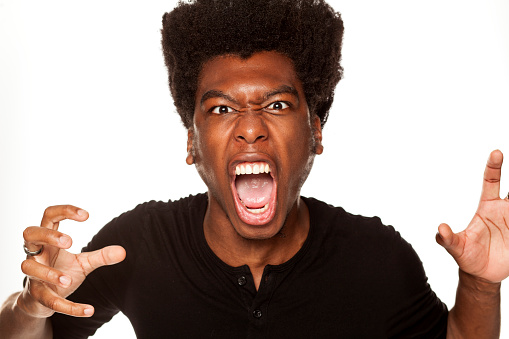 Portrait of young aggressive african american man  on white background