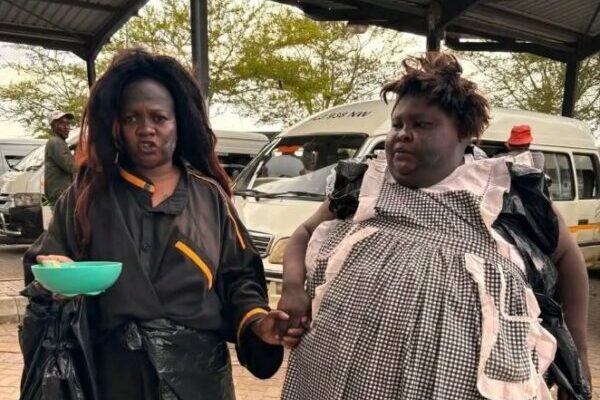 Tsekeleke and Black Cat dressed as homeless, begging on streets